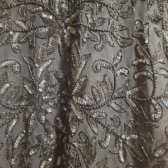 A Niteline by Della Roufogali 100 silk lined embellished blazer in a size small.