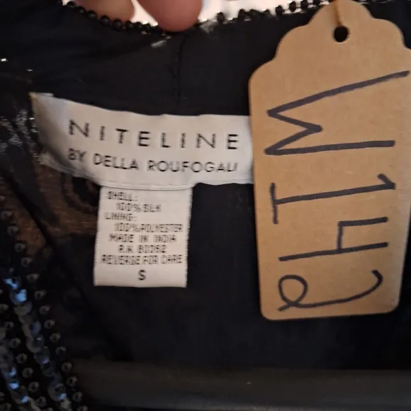 A Niteline by Della Roufogali 100 silk lined embellished blazer in a size small.